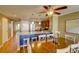 Bright dining room with wooden table and chairs, adjacent to kitchen at 8000 Palmetto Dr # 505, Isle of Palms, SC 29451