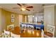 Dining area with wooden table and chairs near kitchen and living room at 8000 Palmetto Dr # 505, Isle of Palms, SC 29451