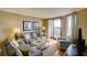 Comfortable living room with hardwood floors and access to a balcony at 8000 Palmetto Dr # 505, Isle of Palms, SC 29451
