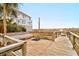 Outdoor shower and bench seating along the boardwalk leading to the beach at 8000 Palmetto Dr # 505, Isle of Palms, SC 29451