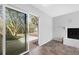 Bright living room featuring tile flooring, fireplace, and sliding glass doors at 824 Farnham Rd, Charleston, SC 29412