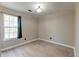 Bright, empty bedroom featuring hardwood floors and a large window, ready for personalization at 9946 Levenshall Dr, Ladson, SC 29456