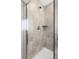 Modern tiled shower with sleek fixtures, offering a luxurious and refreshing experience at 108 Maritime Way, Summerville, SC 29485