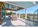 Spacious covered balcony with seating and neighborhood views at 120 Charleston Blvd, Isle of Palms, SC 29451
