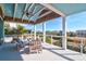 Inviting covered balcony features seating and scenic views at 120 Charleston Blvd, Isle of Palms, SC 29451