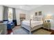 Bright bedroom with a large window, calming colors and a comfortable armchair at 120 Charleston Blvd, Isle of Palms, SC 29451