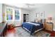Comfortable bedroom with hardwood floors, a large window, and a cozy rug at 120 Charleston Blvd, Isle of Palms, SC 29451