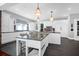 Stylish kitchen with granite island, white cabinetry, and pendant lighting at 120 Charleston Blvd, Isle of Palms, SC 29451