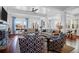 Bright living room with a fireplace, large windows, and comfortable seating arrangements at 120 Charleston Blvd, Isle of Palms, SC 29451
