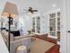 Elegant living room features wood floors, built-in bookcases, and a ceiling fan at 120 Charleston Blvd, Isle of Palms, SC 29451