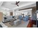 Open-concept living room with hardwood floors, comfortable seating, and views of the kitchen at 120 Charleston Blvd, Isle of Palms, SC 29451