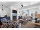 Cozy living room with a fireplace, shiplap walls, and ample seating at 120 Charleston Blvd, Isle of Palms, SC 29451