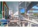 Outdoor patio with comfortable seating, a spiral staircase, and views of the surrounding landscape at 120 Charleston Blvd, Isle of Palms, SC 29451