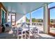 Relaxing covered patio with a dining area, seating, and scenic views at 120 Charleston Blvd, Isle of Palms, SC 29451