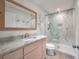 This elegant bathroom features a glass-enclosed shower, a mirror, and a granite-topped vanity at 1365 Dunlin Court, Share C, Kiawah Island, SC 29455