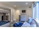 This bedroom has bunkbeds, a comfy couch, stylish dresser, and is bathed in natural light at 1365 Dunlin Court, Share C, Kiawah Island, SC 29455