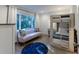 Cozy bedroom featuring a comfortable sofa, large window and stylish bunk beds at 1365 Dunlin Court, Share C, Kiawah Island, SC 29455