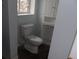 A small powder bathroom featuring a toilet, sink, and a cabinet in a room with light blue paint at 1382 Doctor Evans Rd, Moncks Corner, SC 29461