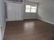 A bedroom with a window, flooring, a closet, and light paint at 1382 Doctor Evans Rd, Moncks Corner, SC 29461