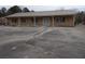 Inviting single-story brick house with a metal roof and a spacious parking lot at 1382 Doctor Evans Rd, Moncks Corner, SC 29461