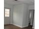 The living room has neutral-toned walls, light-colored floors, and a door to a bathroom at 1382 Doctor Evans Rd, Moncks Corner, SC 29461