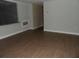 The inside of a room with wooden floors, beige walls, and windows at 1382 Doctor Evans Rd, Moncks Corner, SC 29461