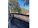 Balcony with a view to the backyard, shaded by trees at 1402 Camp Rd # 15H, Charleston, SC 29412