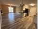 Open living area with access to balcony, showcasing modern kitchen and stylish decor, creating an inviting space at 1402 Camp Rd # 15H, Charleston, SC 29412