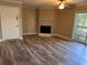 Inviting living room with fireplace and sliding glass doors to balcony, offering a comfortable and bright living space at 1402 Camp Rd # 15H, Charleston, SC 29412