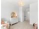 Bright Bedroom with a white dresser, matching armchair, and updated light fixture at 144 Maritime Way, Summerville, SC 29485