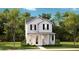 Charming two-story white home featuring a welcoming front porch and beautifully landscaped yard at 144 Maritime Way, Summerville, SC 29485