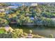 Beautiful aerial view of homes near a lake, golf course and community near a beach at 16 Twin Oaks Lane Ln, Isle of Palms, SC 29451
