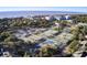 Aerial view showcasing tennis courts, and community buildings near the beach at 16 Twin Oaks Lane Ln, Isle of Palms, SC 29451