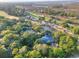 Aerial view featuring luxury real estate by a golf course, pond and lush green landscape at 16 Twin Oaks Lane Ln, Isle of Palms, SC 29451