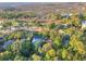 Aerial view showcasing homes nestled amongst trees, with a picturesque view of the marsh and golf course at 16 Twin Oaks Lane Ln, Isle of Palms, SC 29451