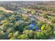 Overhead view of a waterfront house nestled among lush trees near a pristine golf course at 16 Twin Oaks Lane Ln, Isle of Palms, SC 29451