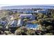 Community aerial view featuring lush trees, a swimming pool, and the ocean in the background at 16 Twin Oaks Lane Ln, Isle of Palms, SC 29451