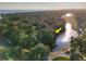 Scenic aerial view of waterfront home in a lush, green golf course community near the ocean at 16 Twin Oaks Lane Ln, Isle of Palms, SC 29451