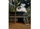 Two-story house featuring a spacious porch, a wooden staircase and mature landscaping at 16 Twin Oaks Lane Ln, Isle of Palms, SC 29451