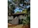 Charming two-story home with a wooden fence and beautiful natural landscaping at 16 Twin Oaks Lane Ln, Isle of Palms, SC 29451