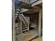 View underneath the structure showing the staircase, wood beams, and supports at 16 Twin Oaks Lane Ln, Isle of Palms, SC 29451