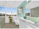 Bright bathroom featuring a garden tub, vanity, and beautiful window view at 1608 Marsh Harbor Ln # C, Mount Pleasant, SC 29464
