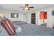 Comfortable bedroom featuring two beds with decorative bedding, ceiling fan, and a view into the bathroom at 1608 Marsh Harbor Ln # C, Mount Pleasant, SC 29464