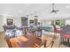Spacious community room featuring plenty of seating and tables, as well as a library and tv area at 1608 Marsh Harbor Ln # C, Mount Pleasant, SC 29464