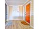 Inviting entrance with wooden flooring and stylish doors to different units with door mats at 1608 Marsh Harbor Ln # C, Mount Pleasant, SC 29464