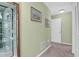 Hallway with a display cabinet, carpet, and neutral colored walls at 1608 Marsh Harbor Ln # C, Mount Pleasant, SC 29464