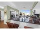 Spacious kitchen featuring marble countertops, stainless steel refrigerator, and natural light at 1608 Marsh Harbor Ln # C, Mount Pleasant, SC 29464