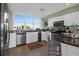 Bright kitchen with granite countertops, stainless steel appliances, and natural light at 1608 Marsh Harbor Ln # C, Mount Pleasant, SC 29464