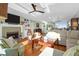 Open-concept living room with fireplace, hardwood floors, and lots of natural light at 1608 Marsh Harbor Ln # C, Mount Pleasant, SC 29464