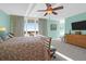 Bright, spacious main bedroom featuring a ceiling fan, large window, and light walls at 1608 Marsh Harbor Ln # C, Mount Pleasant, SC 29464
